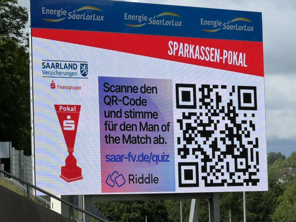 Scan a QR code on the jumbotron to play a live quiz with riddle.com